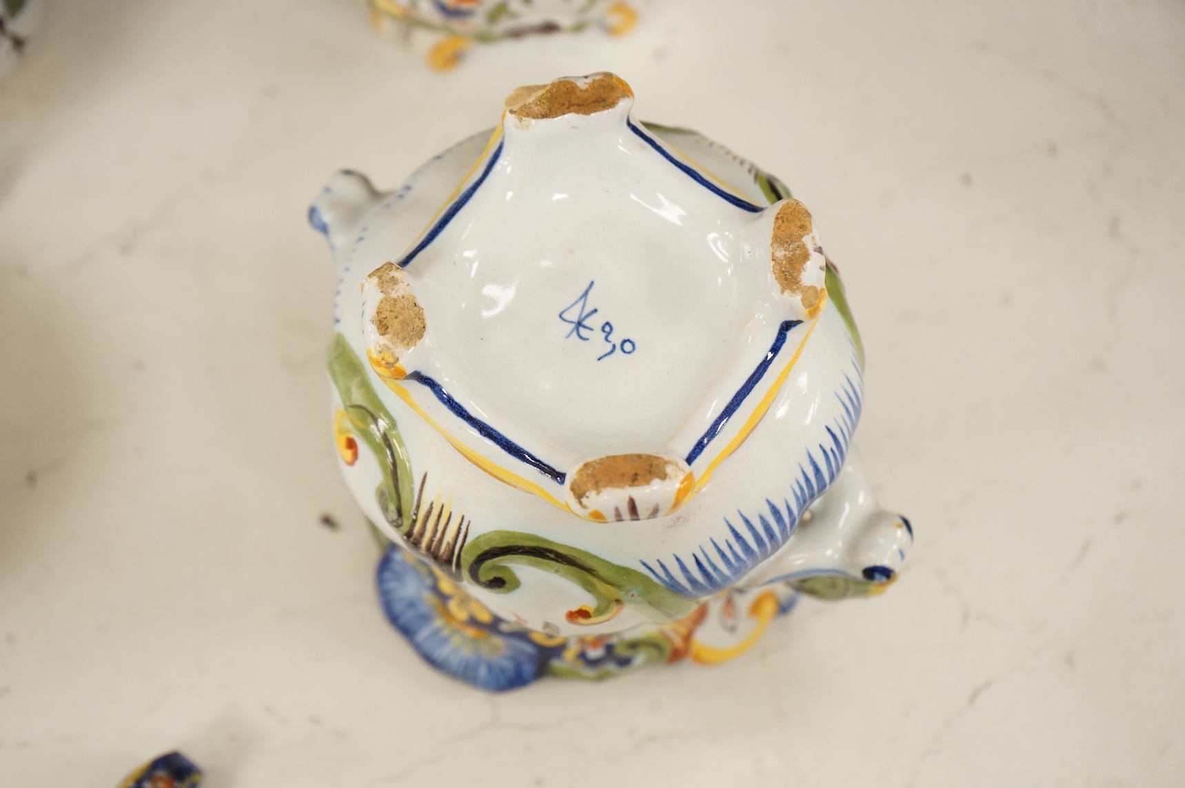 A collection of early 20th century French faience pieces, tallest 37cm